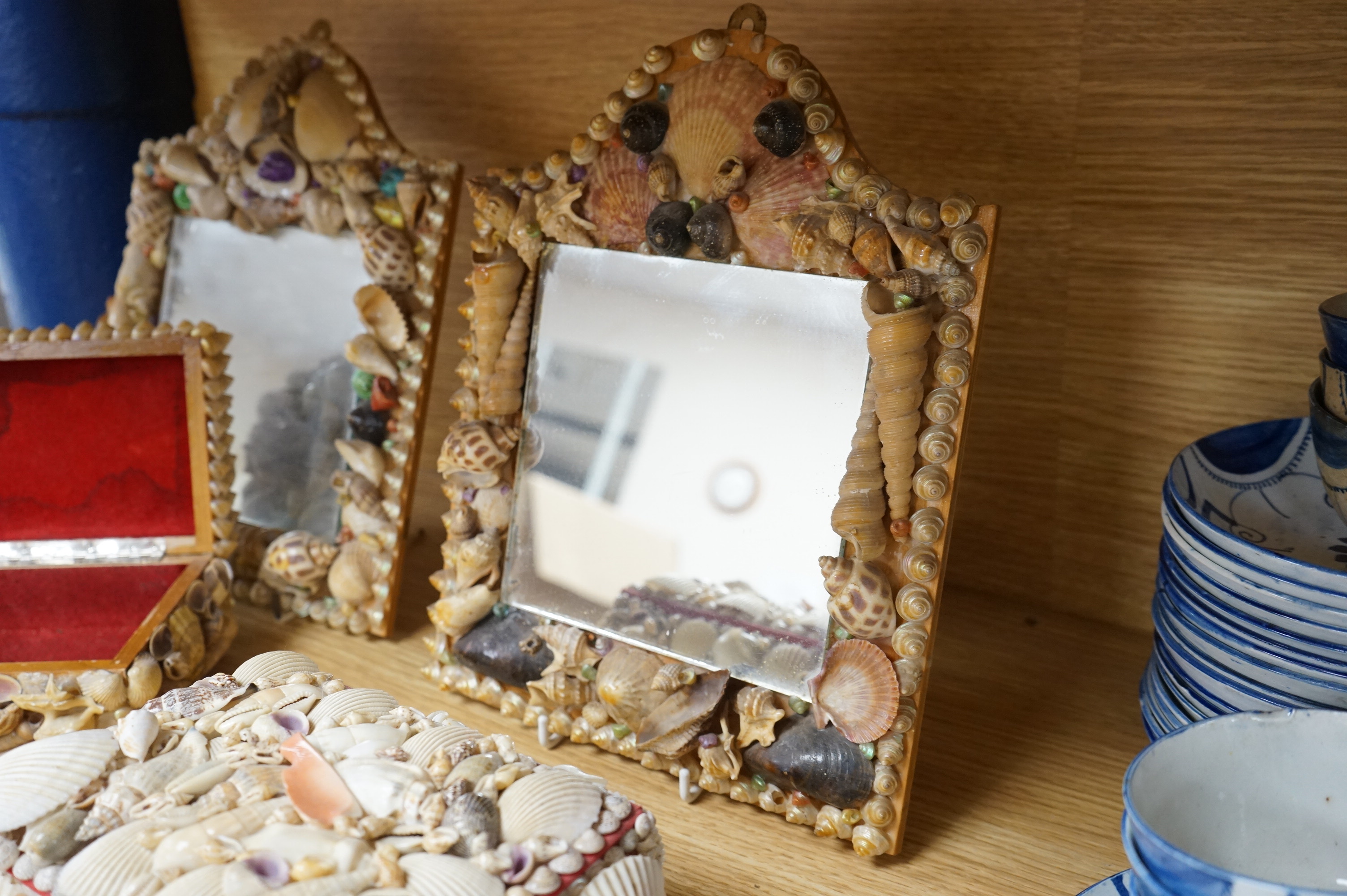 A near pair of French shell applied wall mirrors and three similar boxes, largest 29cm high